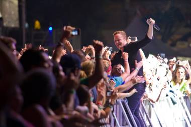 Dan Reynolds of Imagine Dragons interacts with fans during day one of the Life is Beautiful festival in downtown Las Vegas, Saturday, Oct. 26,&nbsp;2013.